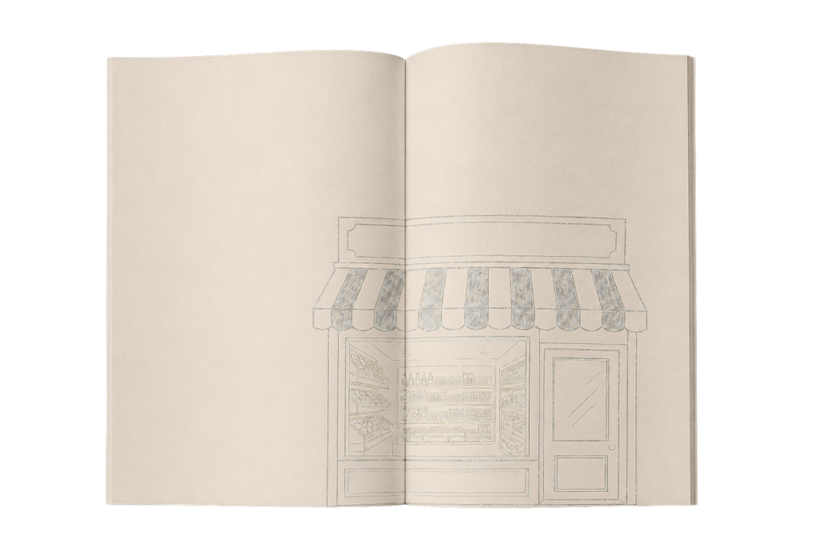 Open magazine with a sketch of a retail storefront